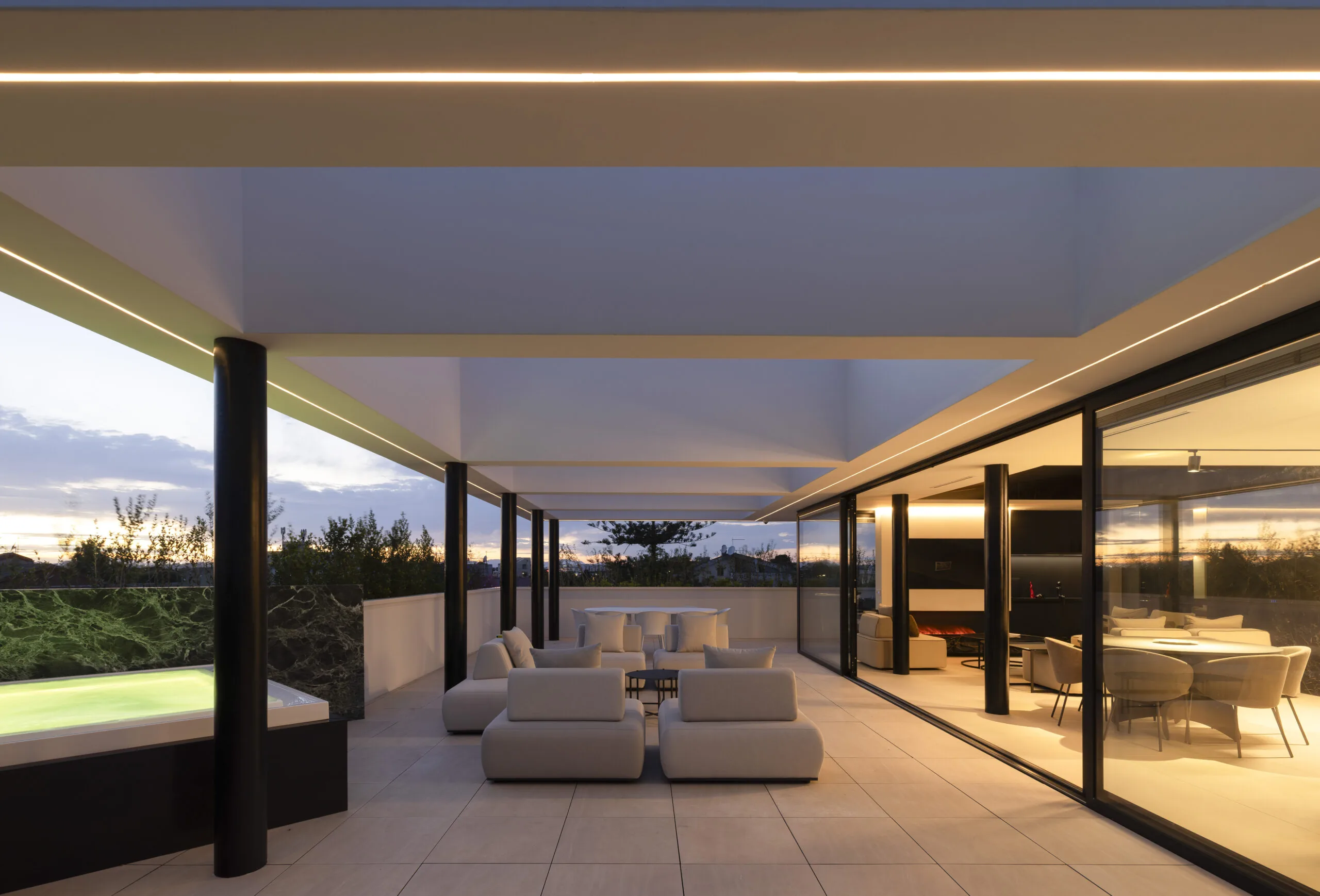 renovated penthouse terrace in Selargius with white pergola